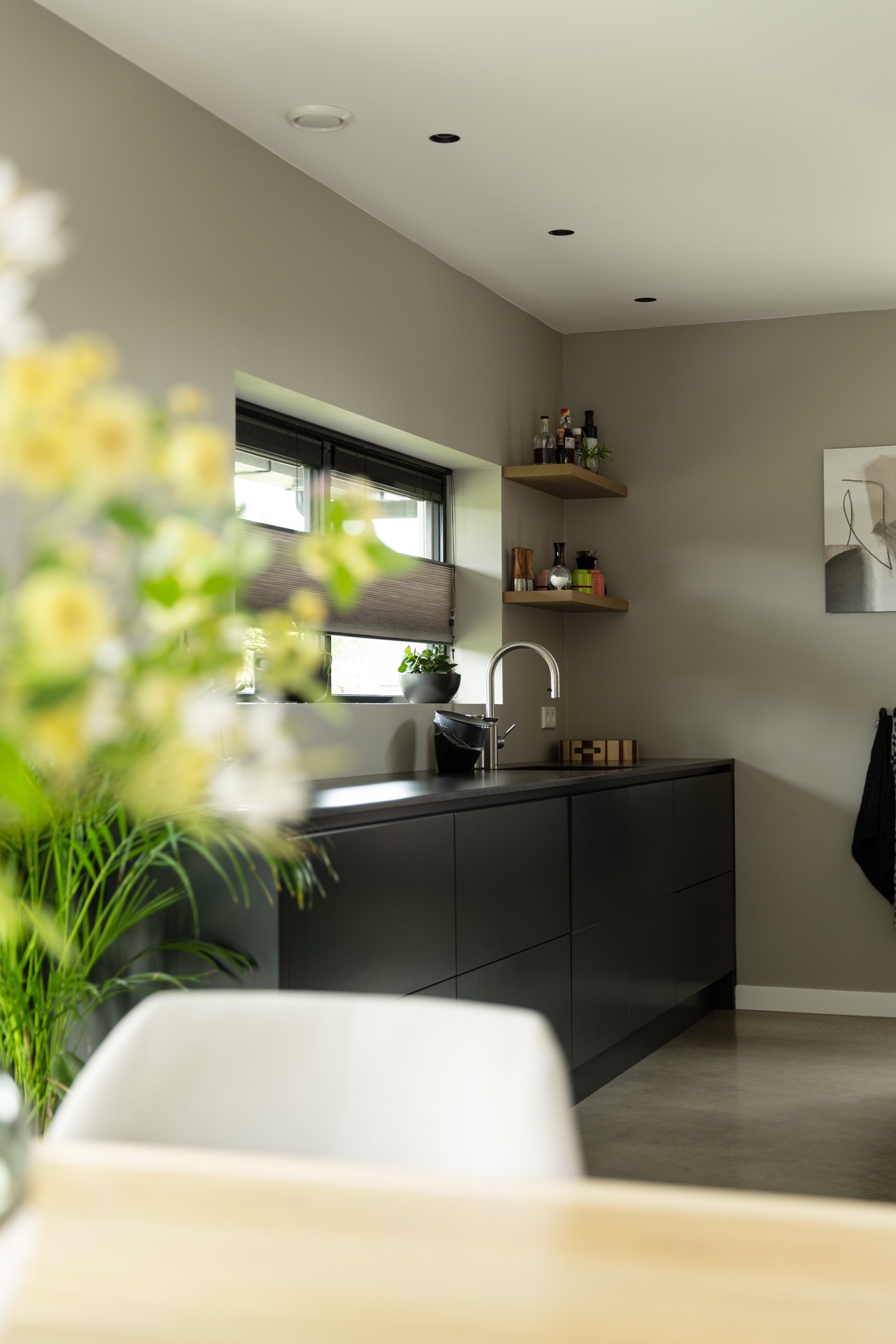 concrete floor in detached house: kitchen with sink by the window, wooden shelves, and dark cabinetry, Luxury, Design, Exclusive, Modern, Custom Made, Special, Beautiful