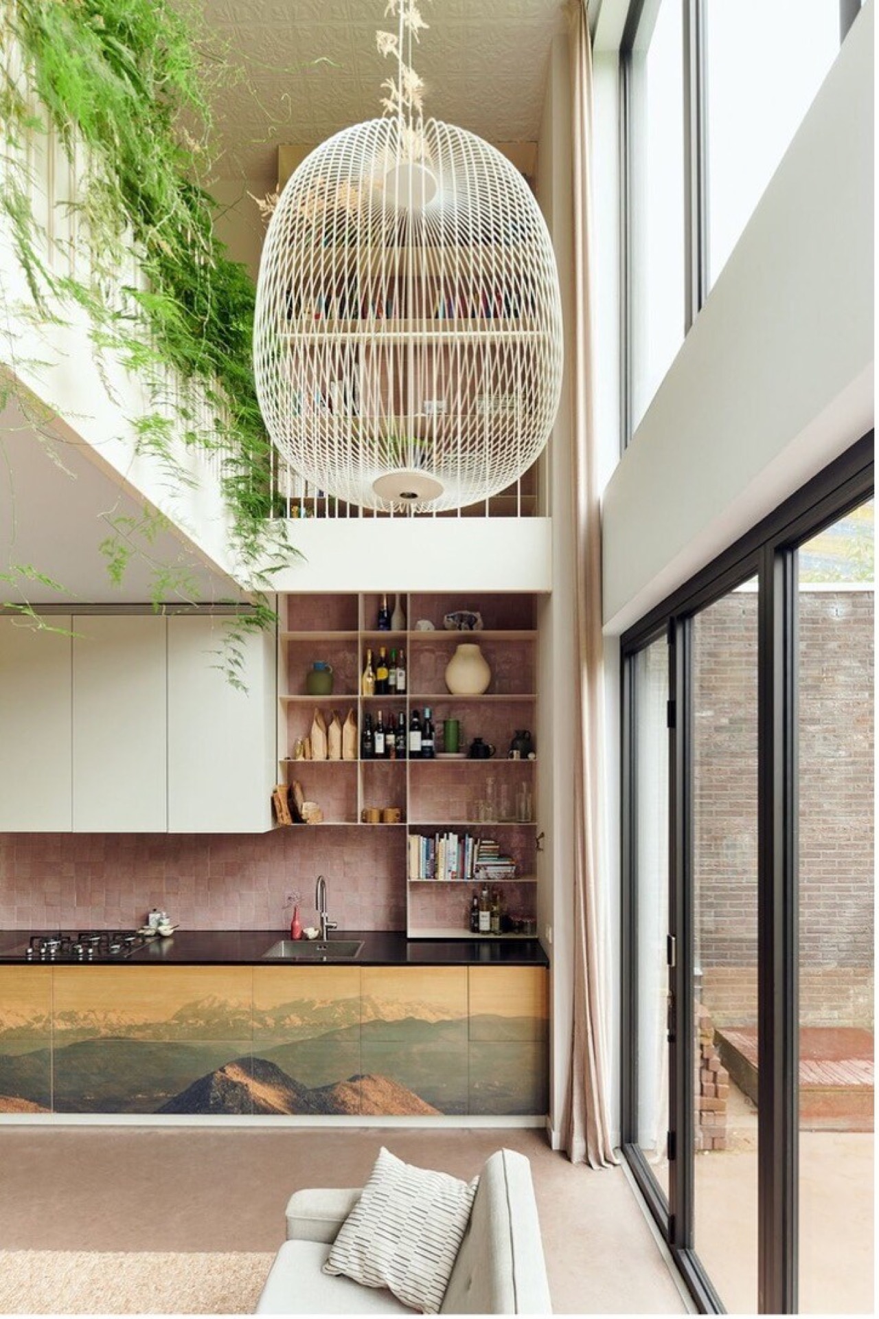 indoor-outdoor connection home: living area with kitchen wall, large glass doors to outside, and a spherical pendant light, Luxe, Design, Exclusief, Modern, Maatwerk, Bijzondere, Mooie