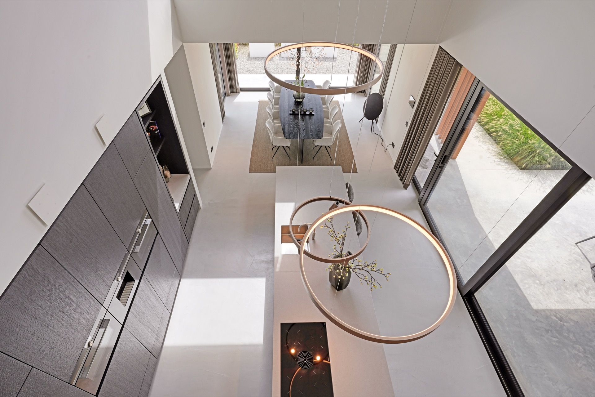 full home interior: aerial view of the living area with round ceiling light, staircase landing and large windows, Luxe, Design, Exclusief, Modern, Maatwerk, Bijzondere, Mooie