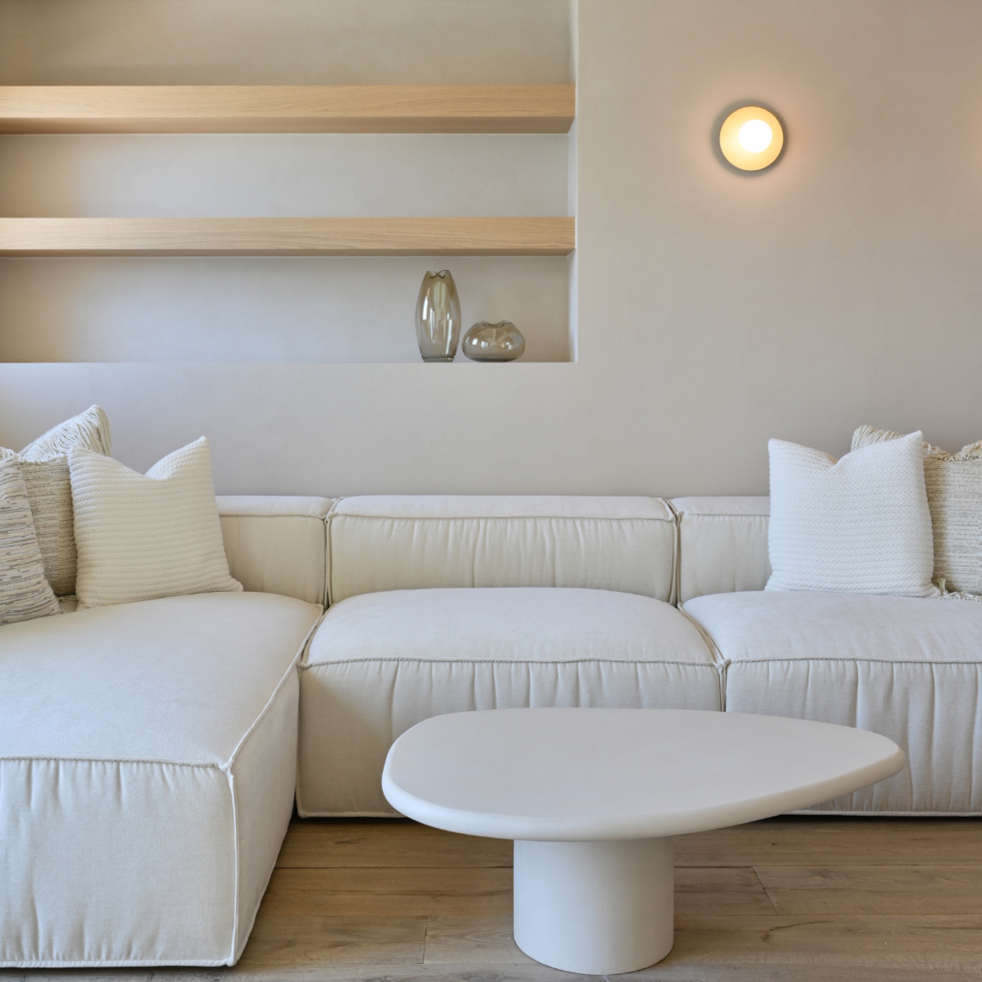 renovated luxury apartment with minimalist interior: living room with warm round wall lights and a built-in niche with, Luxe, Design, Exclusief, Modern, Maatwerk, Bijzondere, Mooie