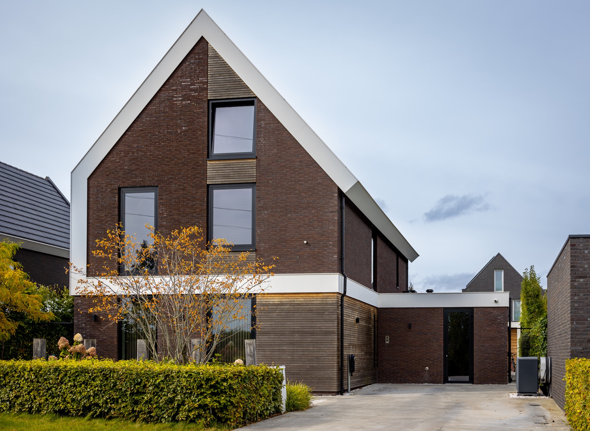 modern villa interior and finishing: facade view of a modern villa with brick, white accents and windows, Luxury, Design, Exclusive, Modern, Custom Made, Special, Beautiful