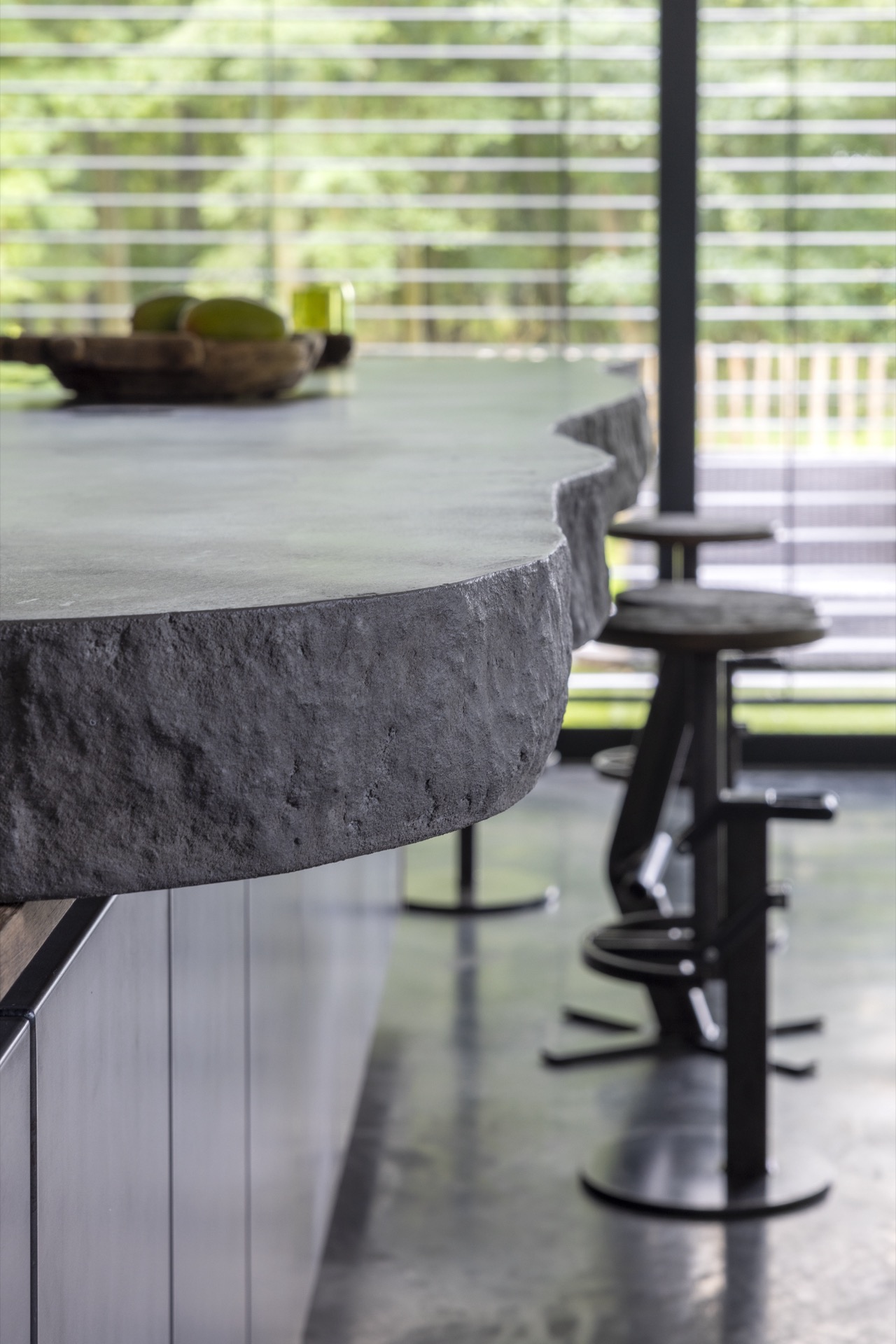 country kitchen with island: close-up of a rounded countertop edge and window view in a country kitchen, Luxury, Design, Exclusive, Modern, Custom Made, Special, Beautiful