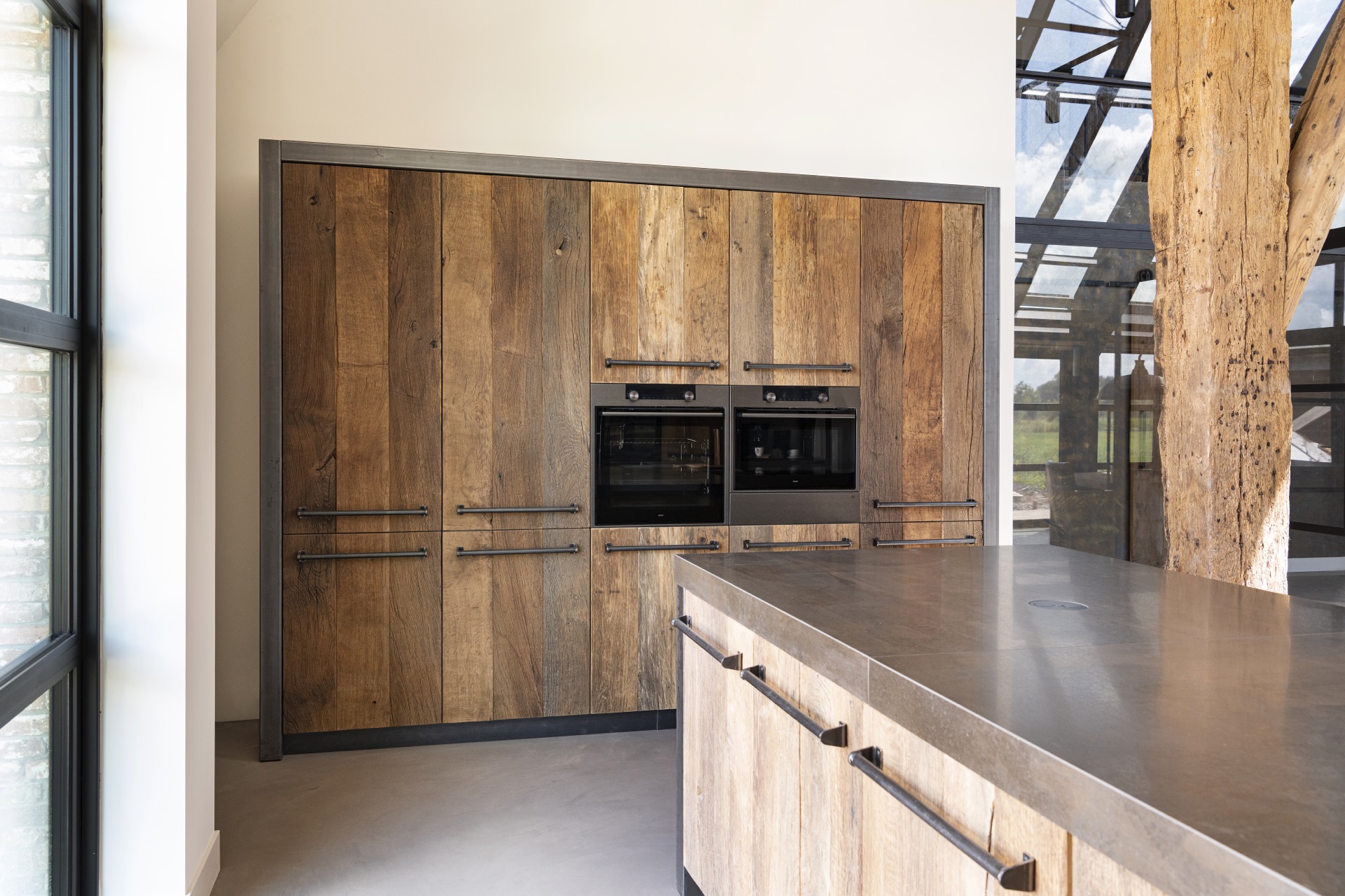 rustic industrial kitchen: kitchen wall with double oven in dark metal frame and wood front panels, Luxury, Design, Exclusive, Modern, Custom Made, Special, Beautiful