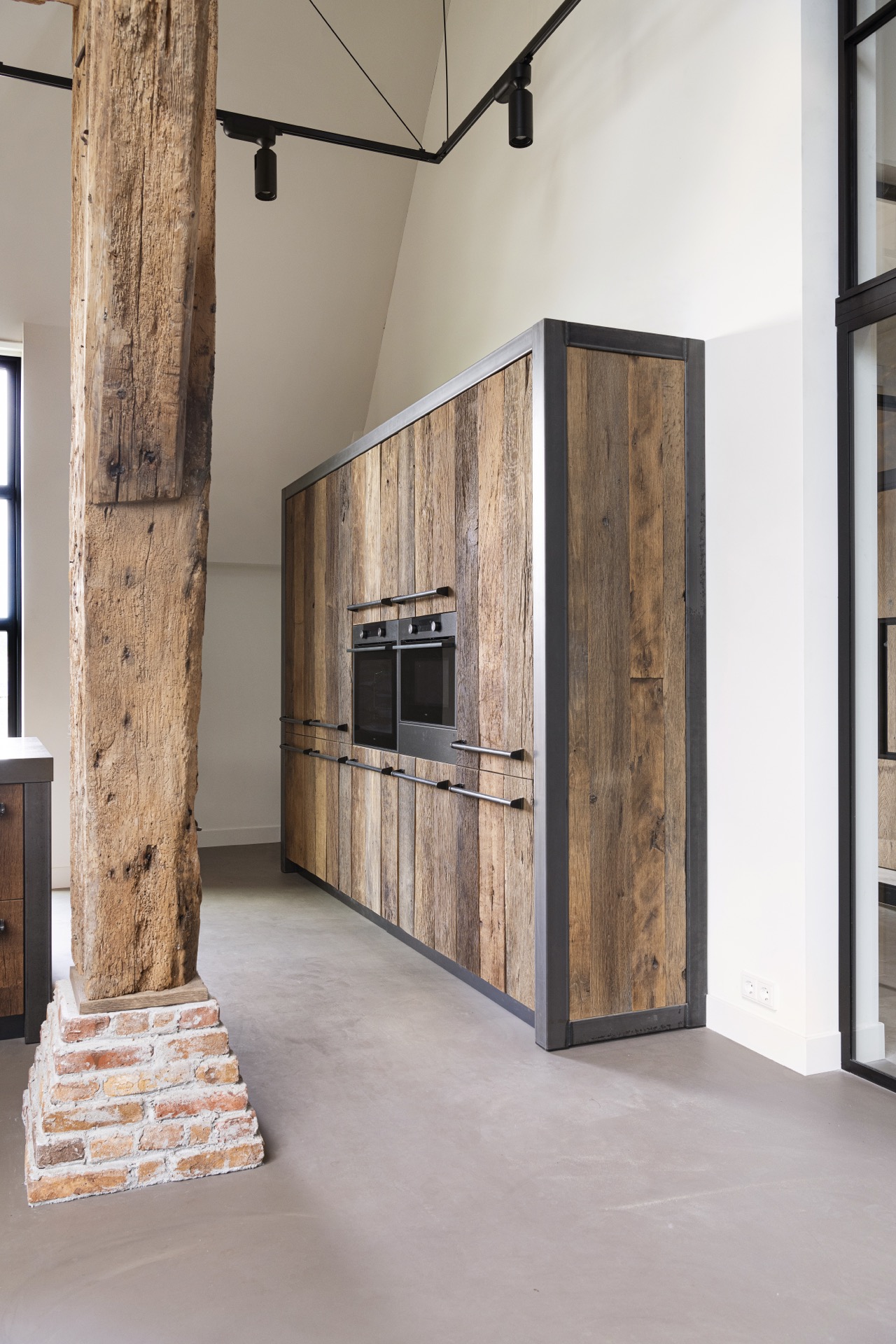 rustic industrial kitchen: tall kitchen cabinet with wood fronts, dark metal frame and visible timber column, Luxury, Design, Exclusive, Modern, Custom Made, Special, Beautiful