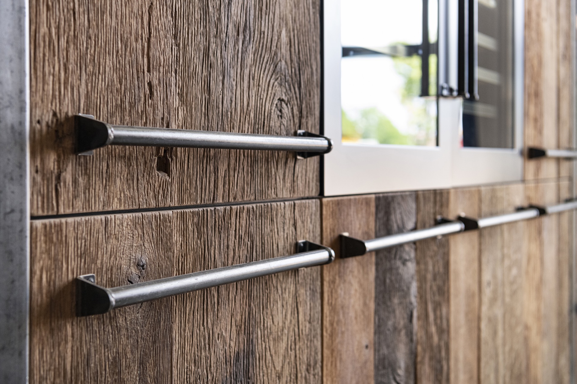rustic industrial kitchen: close-up of a dark metal handle on a wooden kitchen cabinet front, Luxury, Design, Exclusive, Modern, Custom Made, Special, Beautiful
