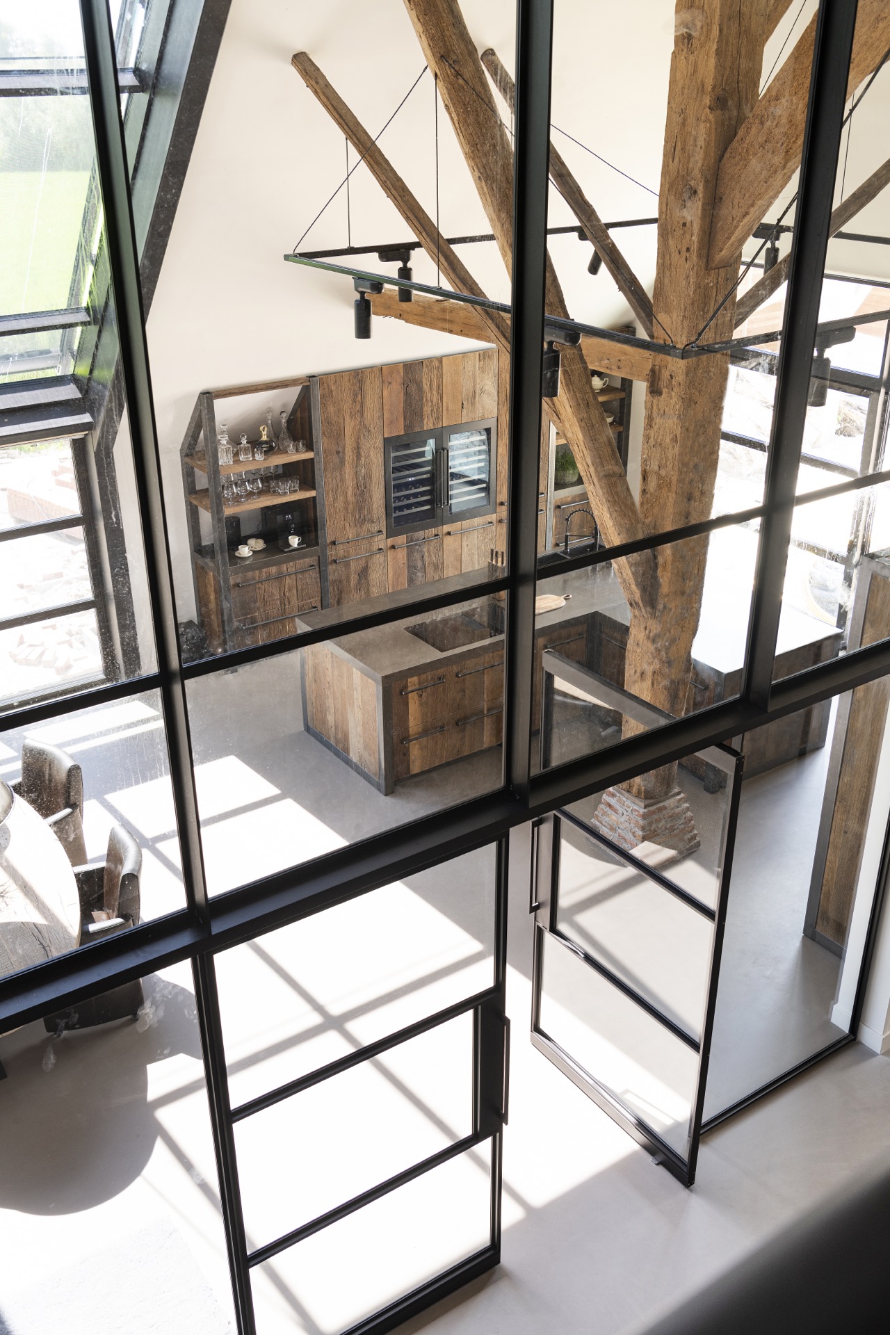 rustic industrial kitchen: view from the mezzanine/stair area over the kitchen below with industrial metal balustrade, Luxury, Design, Exclusive, Modern, Custom Made, Special, Beautiful