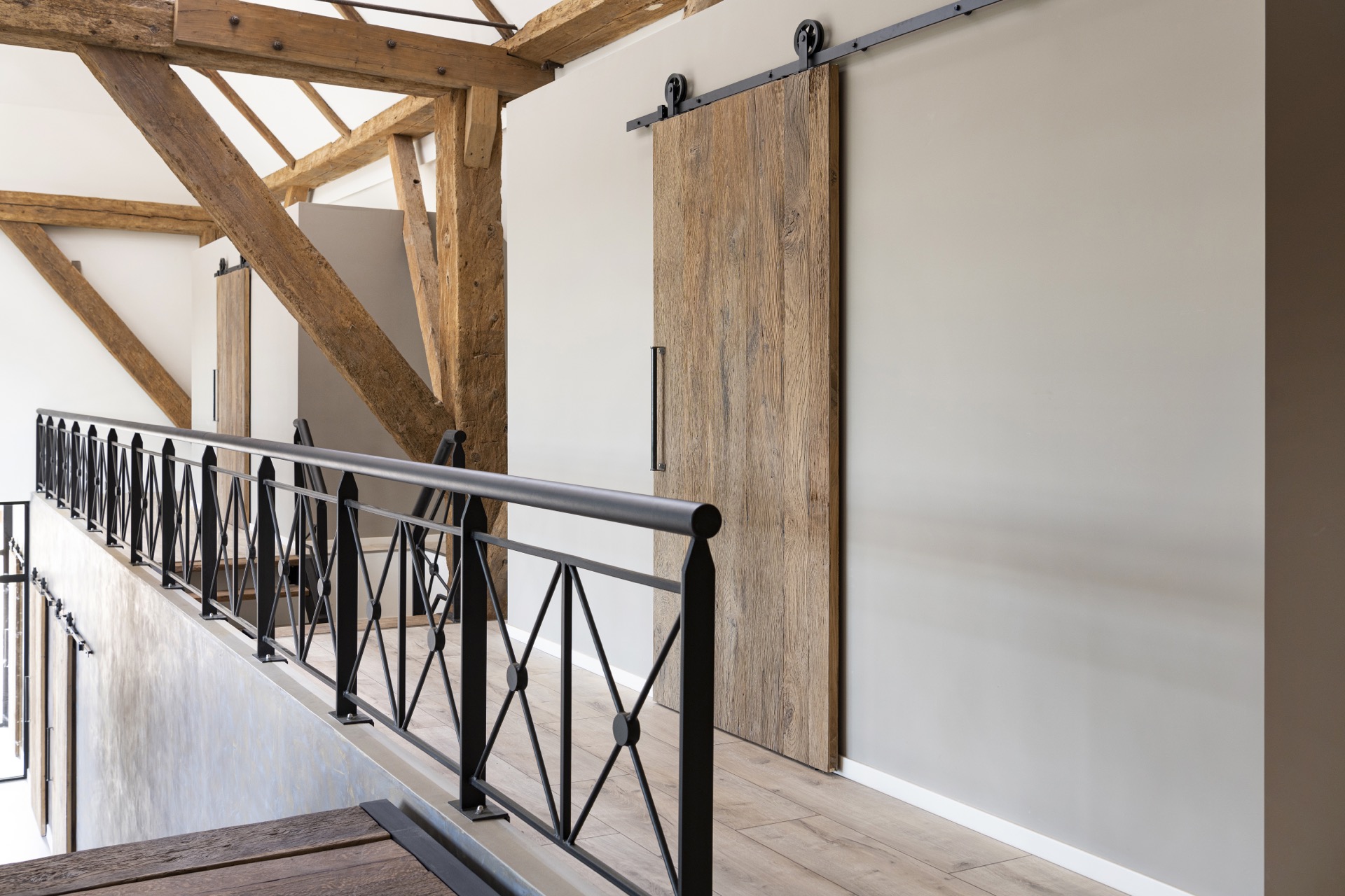 rustic industrial kitchen: stair railing with dark metal balustrade and view of wooden beams in the interior, Luxury, Design, Exclusive, Modern, Custom Made, Special, Beautiful