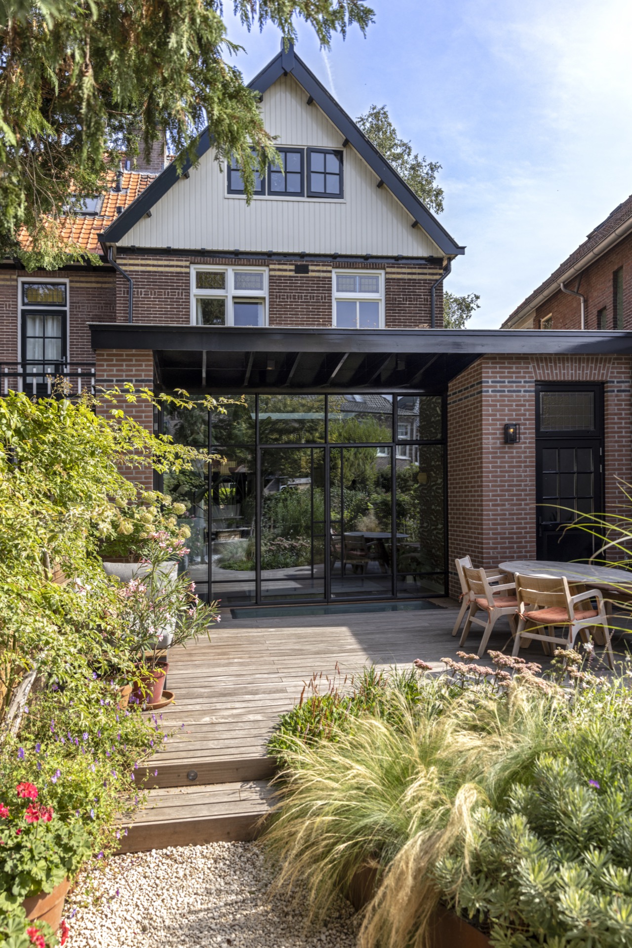 home extension design: extended facade with roof extension and large windows, brick and wood combination., Luxury, Design, Exclusive, Modern, Custom Made, Special, Beautiful